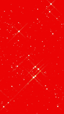 a close up of a red background with sparkles