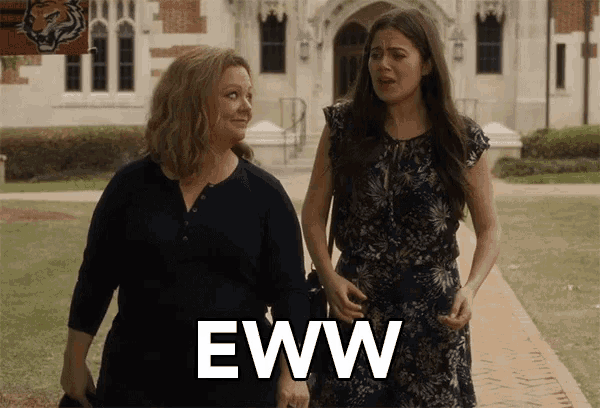 two women walking down a sidewalk with the word eww written on the sidewalk