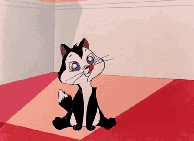 a black and white cartoon cat with blue eyes is sitting on a red floor
