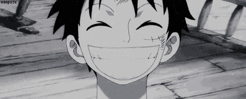 monkey d luffy from one piece is smiling in a black and white image .