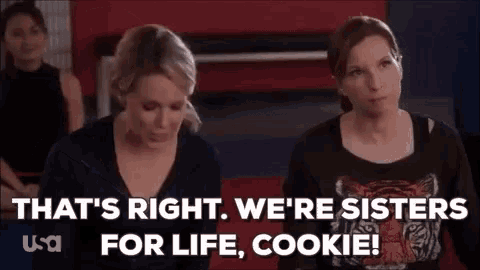two women are sitting next to each other in a room and one of them is talking about life and cookie .