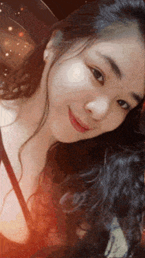 a close up of a woman 's face with a blurred background