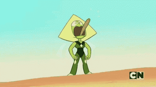 a cartoon character is standing on top of a sandy hill holding a stick in his mouth .