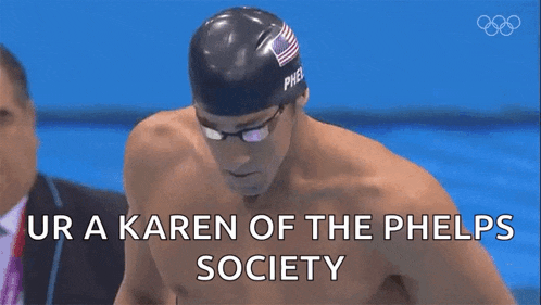 a man in a swimming cap and goggles is saying ur a karen of the phels society
