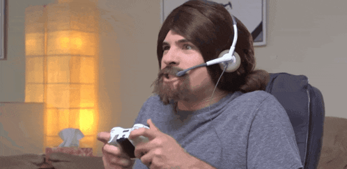 a man wearing a wig and headphones holds a video game controller