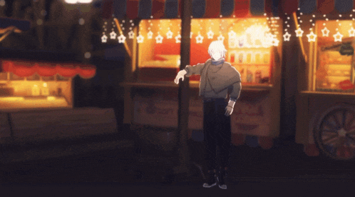 a man standing in front of a store that says soft drinks