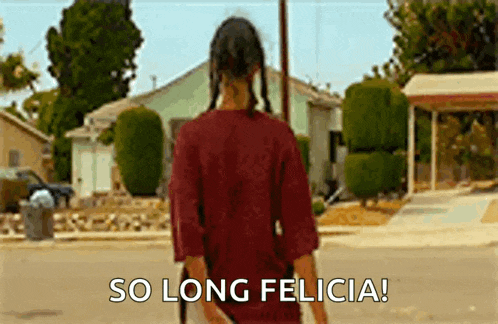 a woman in a red shirt is walking down a street with the words `` so long felicia '' written on the screen .