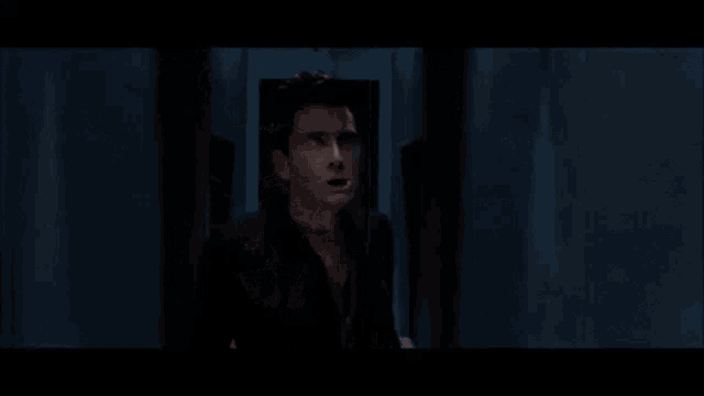 a man is screaming with his mouth open and the words `` grow better '' written on the screen .