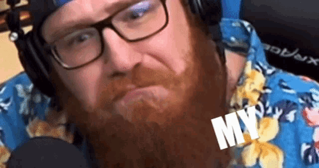 a man with a beard wearing headphones and a shirt that says my on it