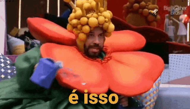 a man in a flower costume is holding a watering can