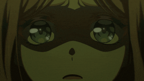 a close up of a girl 's face with a surprised expression