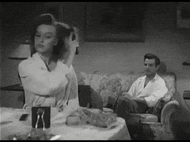 a black and white photo of a man and a woman