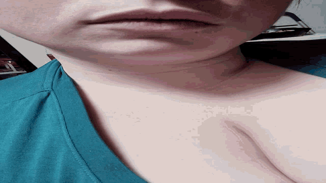 a close up of a person 's neck and chest