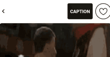 a screenshot of a video with the caption button and a heart .