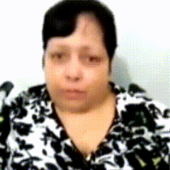 a woman wearing a black and white floral shirt