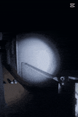 a dark room with a light shining on it and a watermark that says " zut "