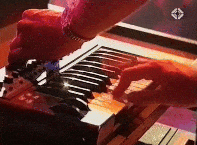 a close up of a person playing a keyboard with an arrow pointing to the left