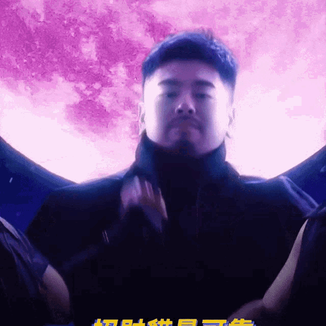 a man stands in front of a full moon with chinese writing on the bottom right