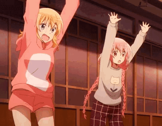 two anime girls with their hands in the air