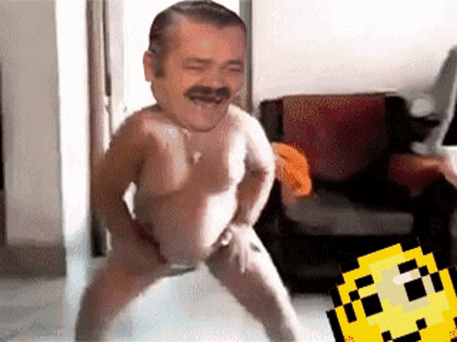 a man without a shirt is dancing in front of a pixelated smiley face