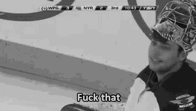 a hockey goalie is sitting on the ice and saying fuck that .