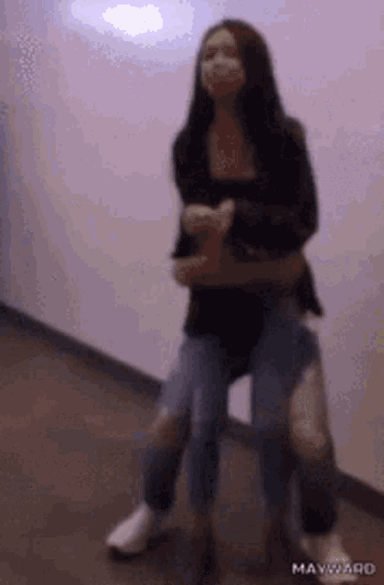 a woman is sitting on another woman 's shoulders