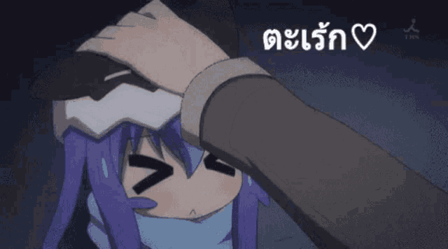a person putting their hand on a girl 's forehead with a heart in the lower right corner