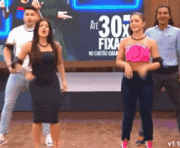 a group of people are dancing in front of a sign that says 30x fixa