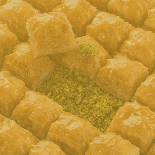 a close up of baklava with the words ava 's b of sweet making in the background