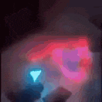 a close up of a person 's face with a red and blue light behind it .