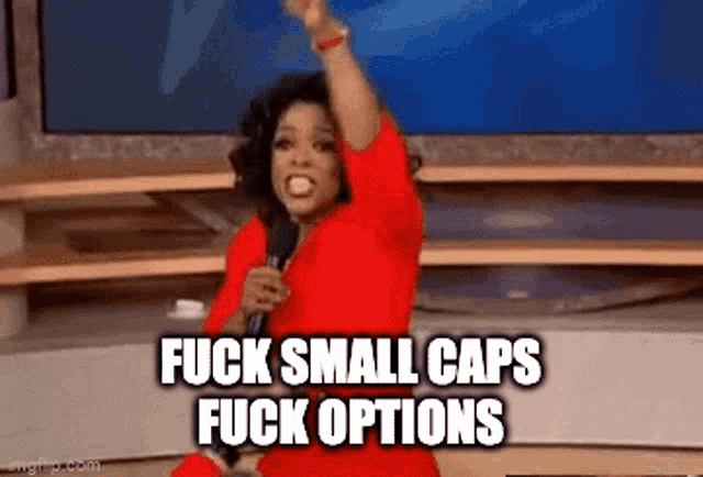 a woman in a red dress is holding a microphone and says fuck small caps fuck options