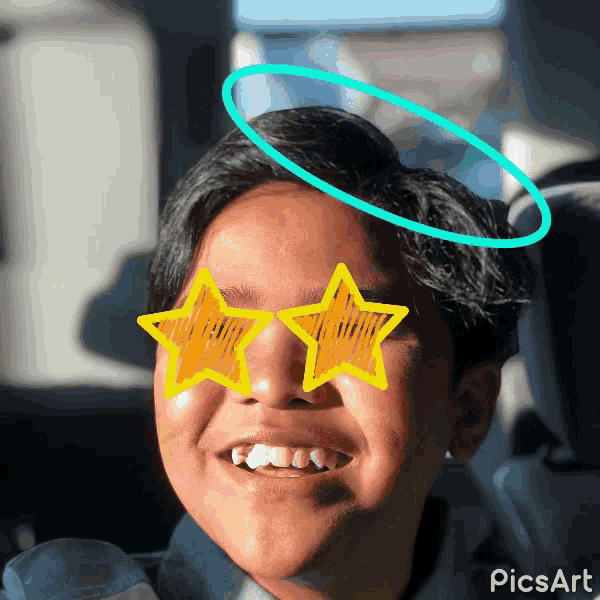 a young boy with a blue halo on his head and yellow stars on his eyes