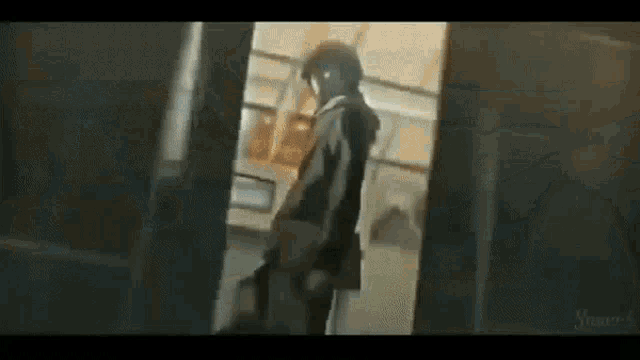 a man is standing in a doorway holding a gun in a dark room .