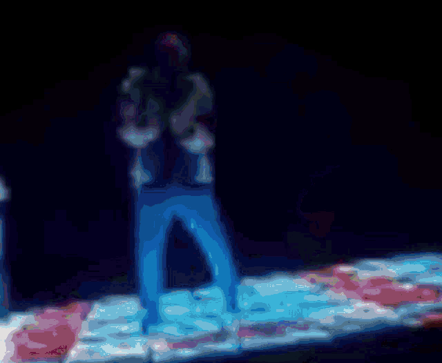 a blurry picture of a person 's face in purple and blue