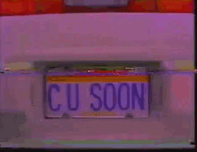 a close up of a license plate that says cu soon