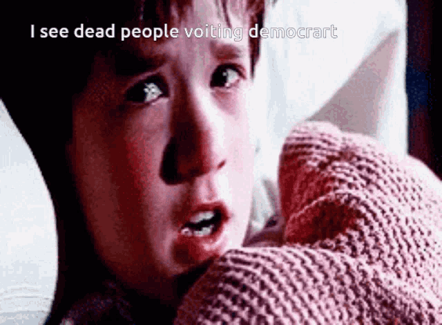 a child is laying in bed with a pink blanket and the words " i see dead people voiting democrat "