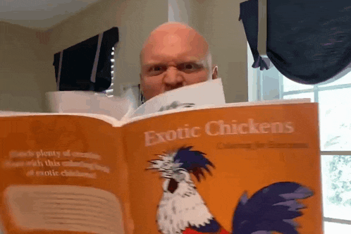 a bald man reads a book called exotic chickens