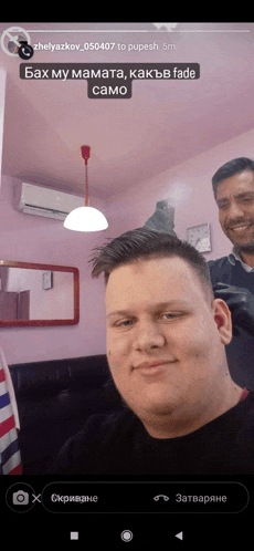 a man is getting his hair cut by a barber in a room