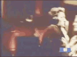 a blurry picture of a person with a trl logo on the bottom right
