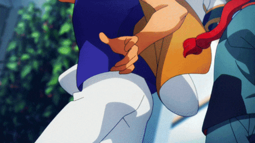 a man in a blue shirt is holding another man 's hand behind his back
