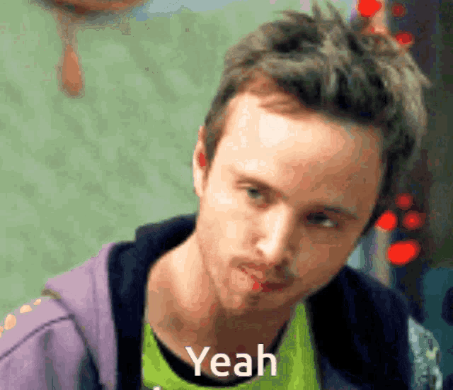 a close up of a man 's face with the word yeah in the corner