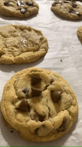 a close up of a chocolate chip cookie with a face on it