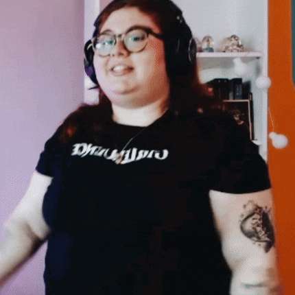 a woman wearing headphones and a t-shirt that says ' drums ' on it