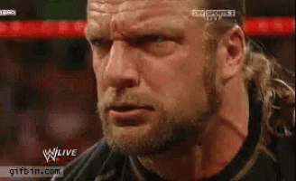a close up of a man 's face with the words w live on the bottom