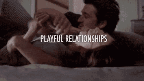 a man and a woman are laying on a bed and the words playful relationships are written above them .