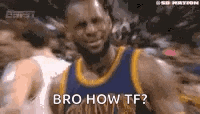 a basketball player in a blue and yellow jersey is smiling and talking to the camera .