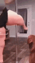 a person is standing on a pole in a room .