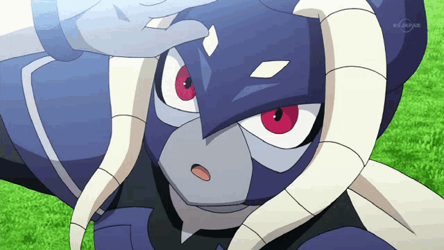 a cartoon character with red eyes and white horns is shown on a television screen