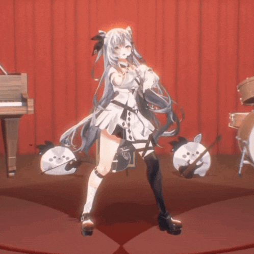 a girl in a white dress is standing on a stage with a piano in the background