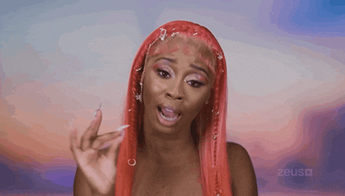 a woman with red hair is making a funny face and the word zeus is on the bottom